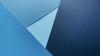 Geometric patterns inspired by scent molecules layered over slate background.