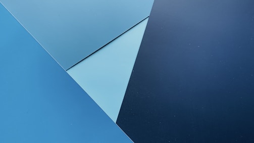 Geometric patterns inspired by scent molecules layered over slate background.