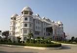 a large white building with many windows and balconies
