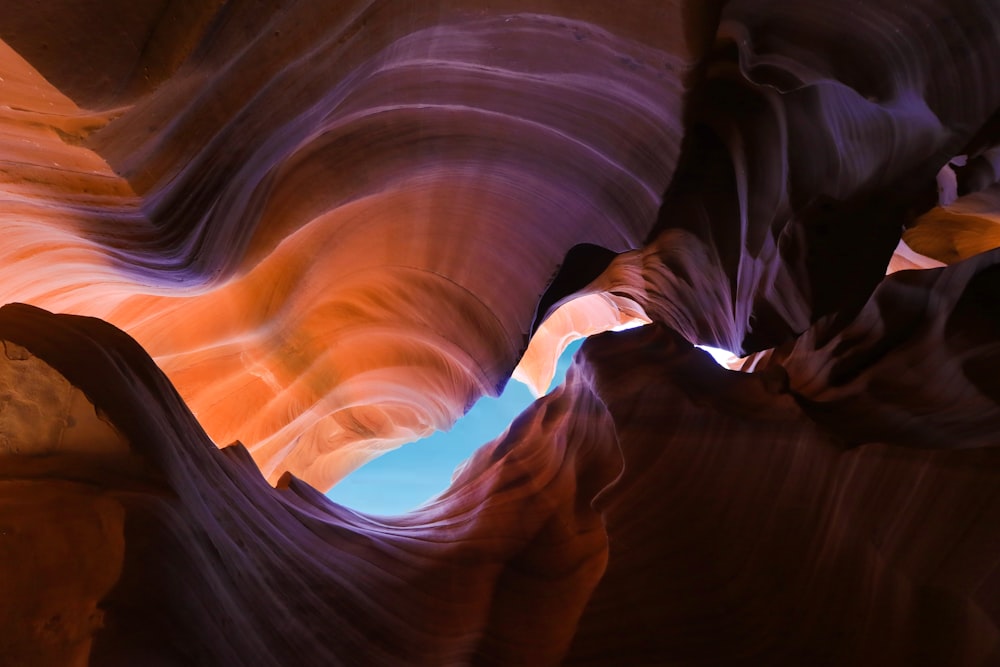 a narrow canyon with a blue sky in the background