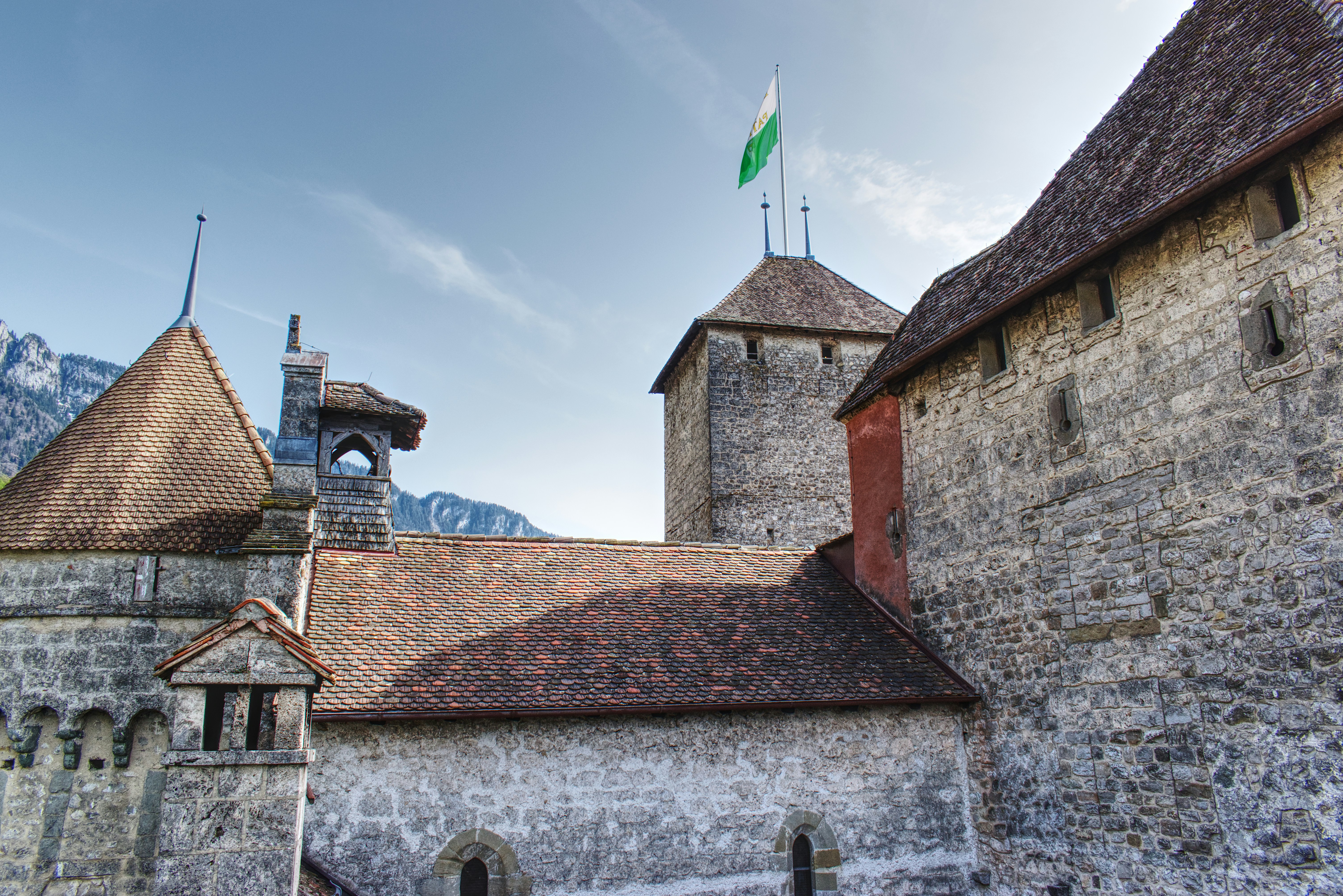 an old building with a flag on top of it