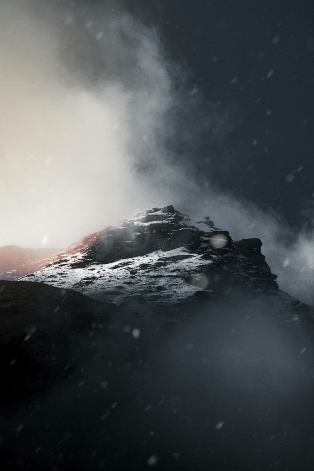 a mountain covered in snow with a sky background