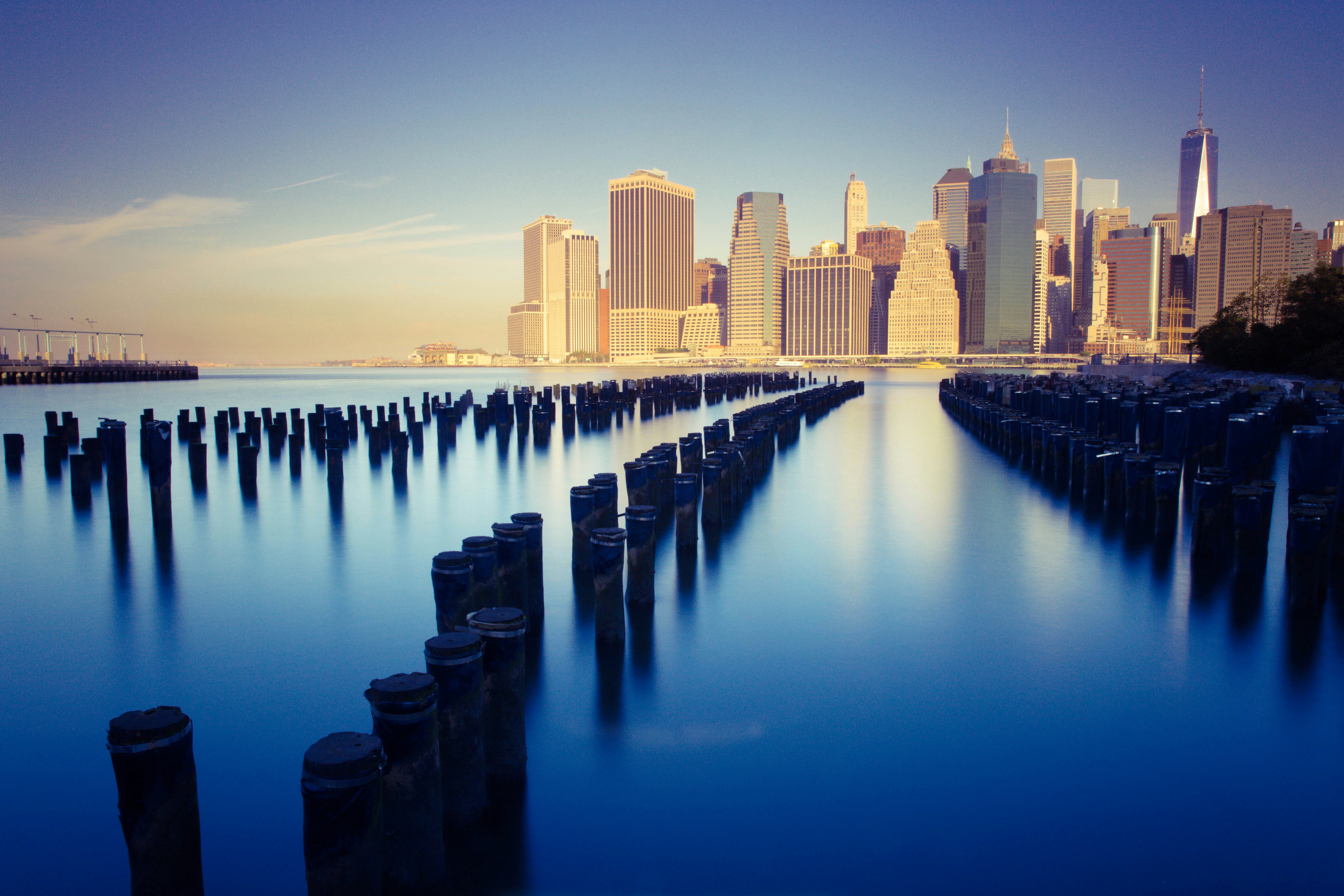 a large body of water with a city in the background