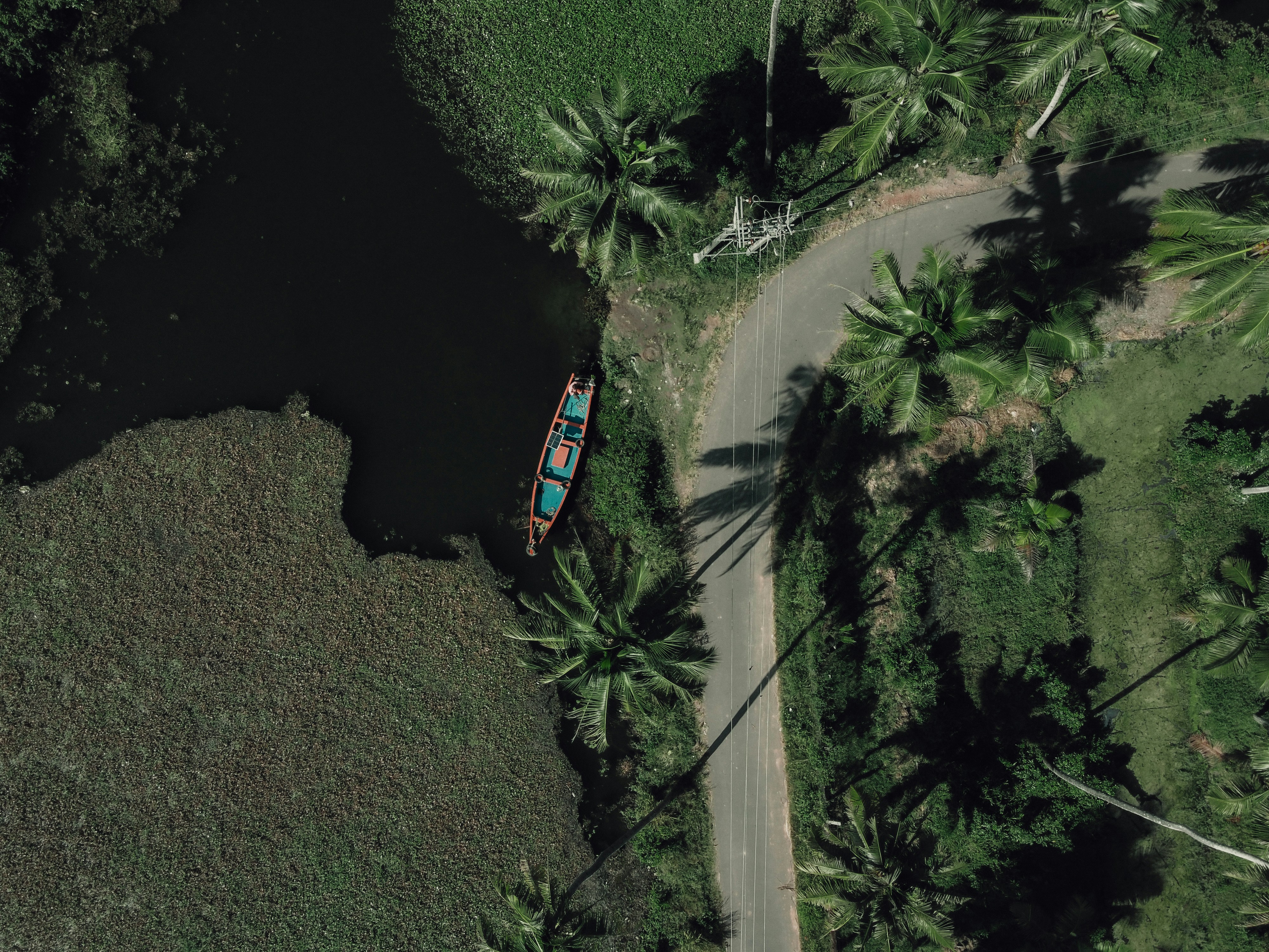 an aerial view of a boat on the water