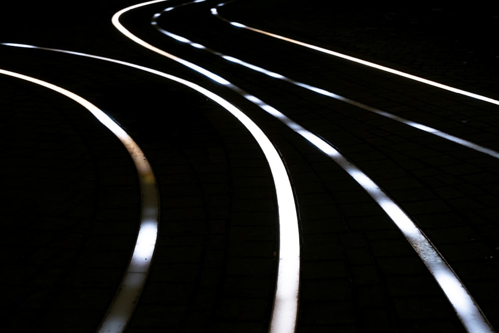a view of a train track in the dark