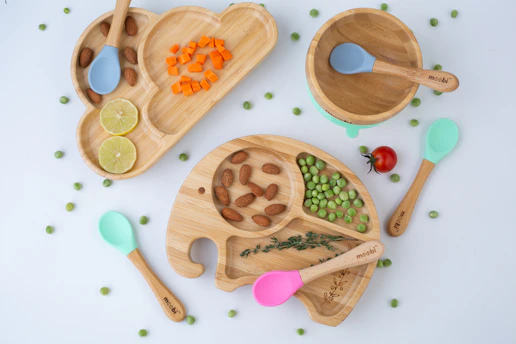 a variety of wooden spoons and bowls filled with food