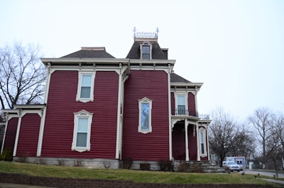 a large red house with a clock tower