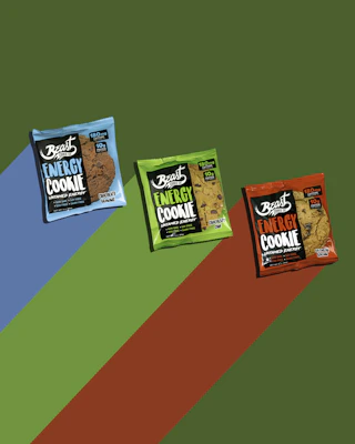 A hand holding a pack of energy-boosting vitamin gums with a lively, fresh design.