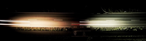 Close-up of a modern road with embedded smart sensors glowing softly.