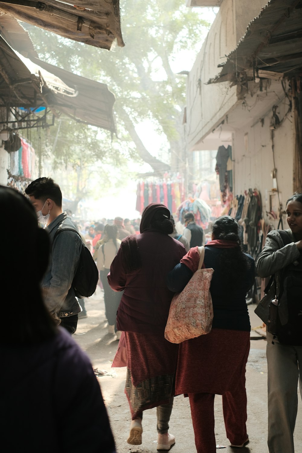 a group of people walking down a street