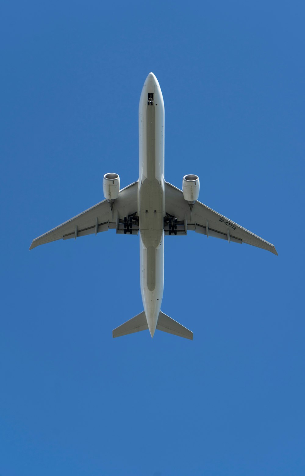 a large jetliner flying through a blue sky