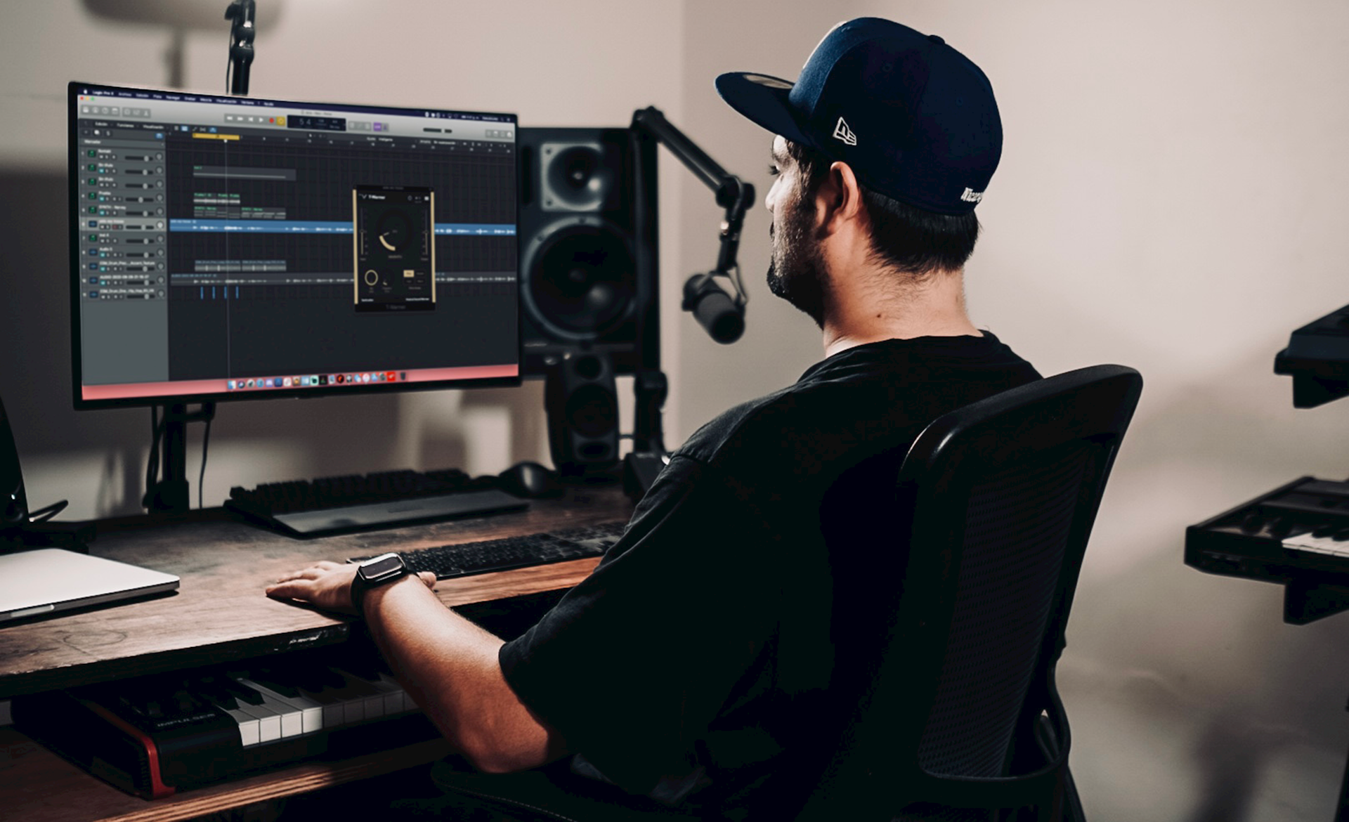 a man sitting at a desk in front of a computer