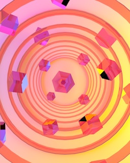 Geometric shapes with a focus on cubes arranged in a symmetrical pattern. The cubes appear to be transparent with tones of pink, orange, and purple. These shapes are placed against a background of concentric circles with a gradient ranging from pink to yellow.