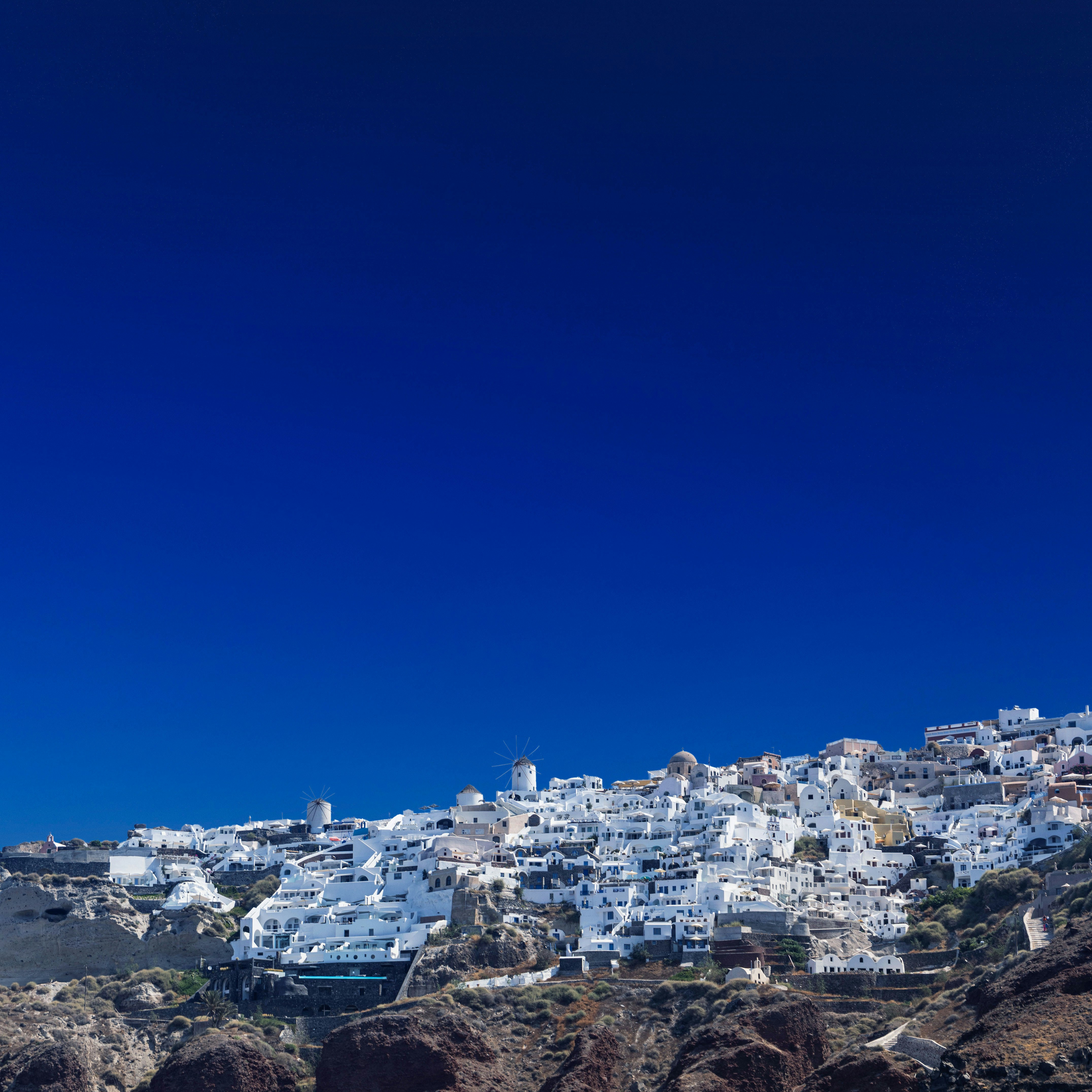 a view of a white village on a hill