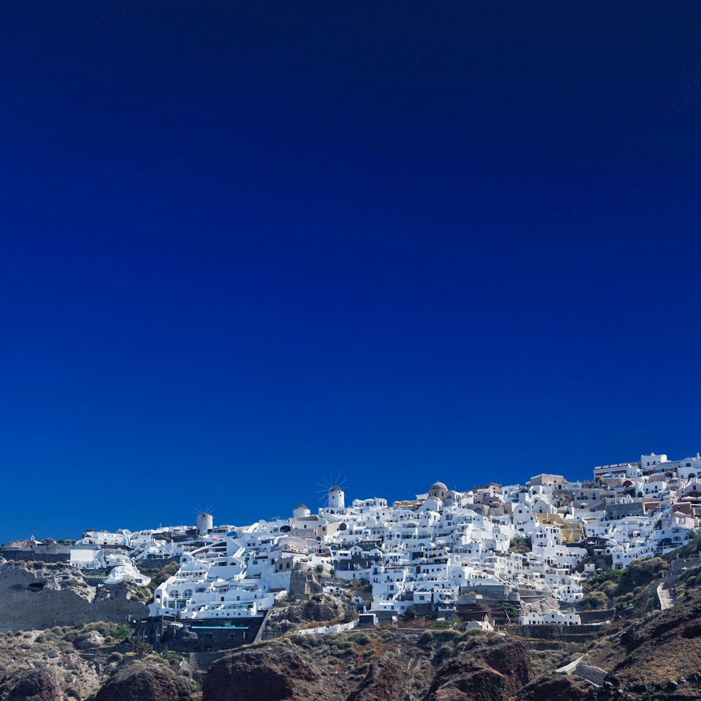 a view of a white village on a hill