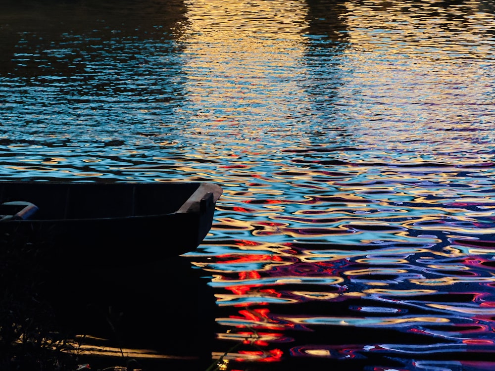 a boat floating on top of a body of water