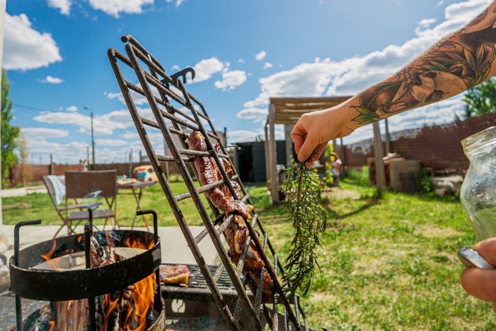 a man is cooking food on a grill