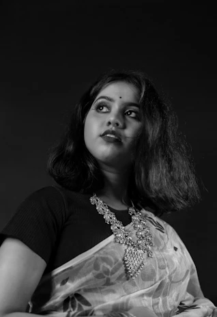 A professional portrait of Ms. Jahnabi Balaji, founder of The Southern Global Mercantile, in a modern office setting.