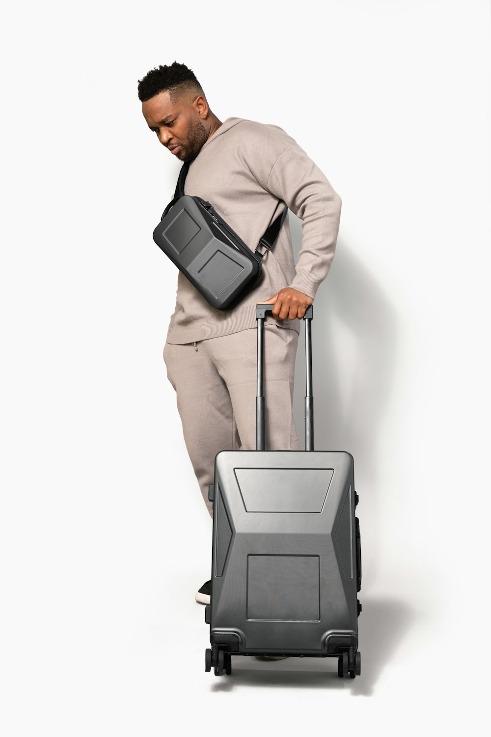 a man in a suit carrying a suitcase