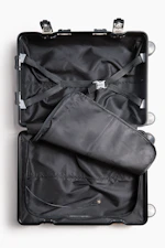 a suit case is open on a white surface