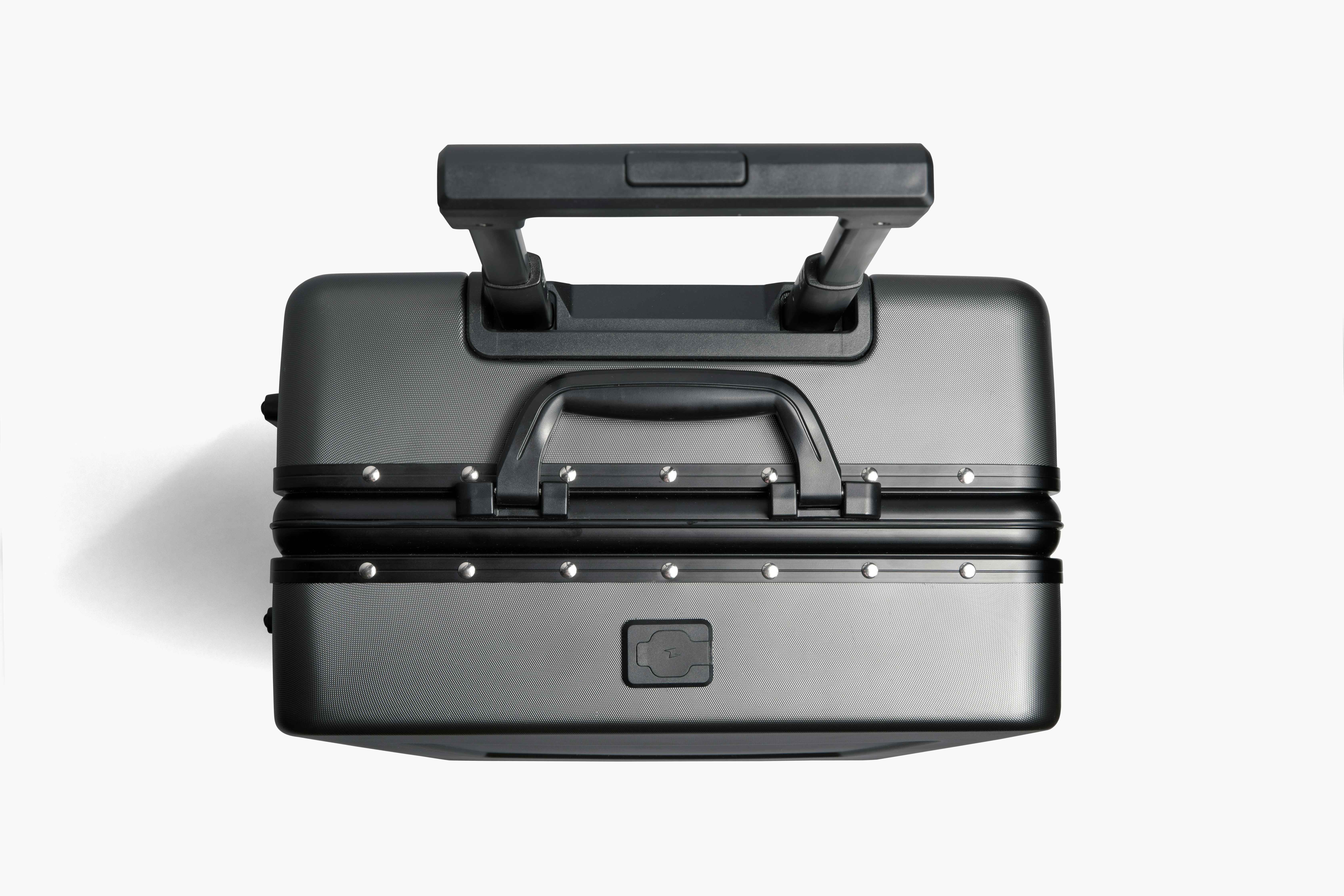 a black and silver piece of luggage on a white background, 