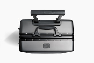 a black and silver piece of luggage on a white background