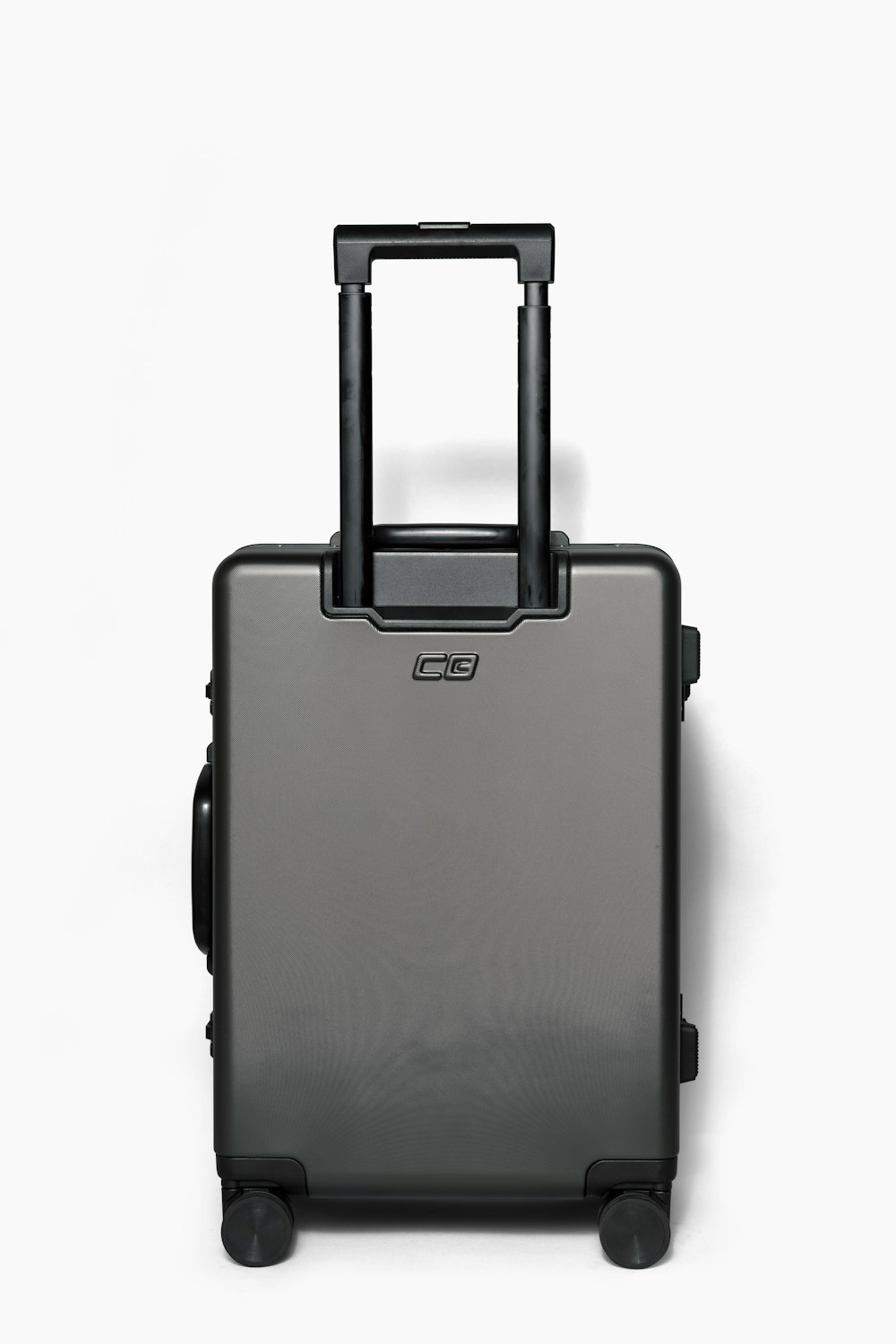a black suitcase with wheels on a white background