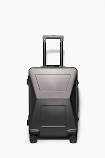 A sleek black suitcase with expandable compartments and a wet-dry separation feature.