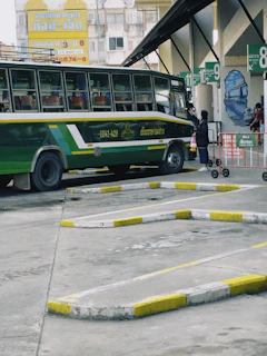 A friendly customer service representative answering a phone call at a bus station.