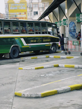 A friendly customer service representative answering a phone call at a bus station.