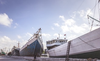 a couple of large boats sitting next to each other