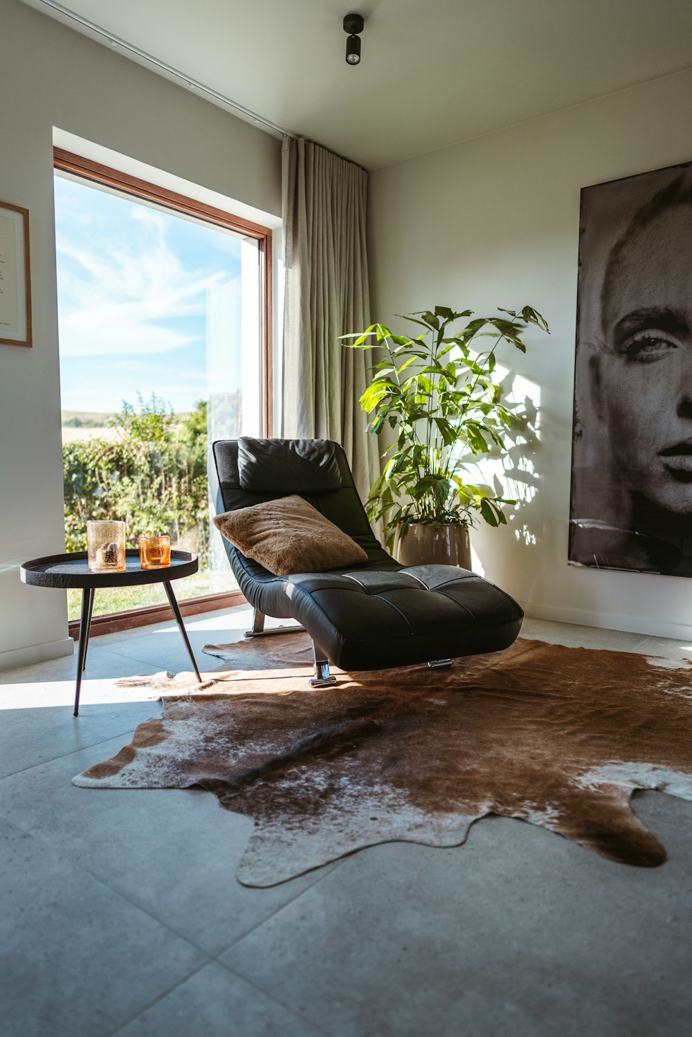 a living room with a cow hide rug on the floor
