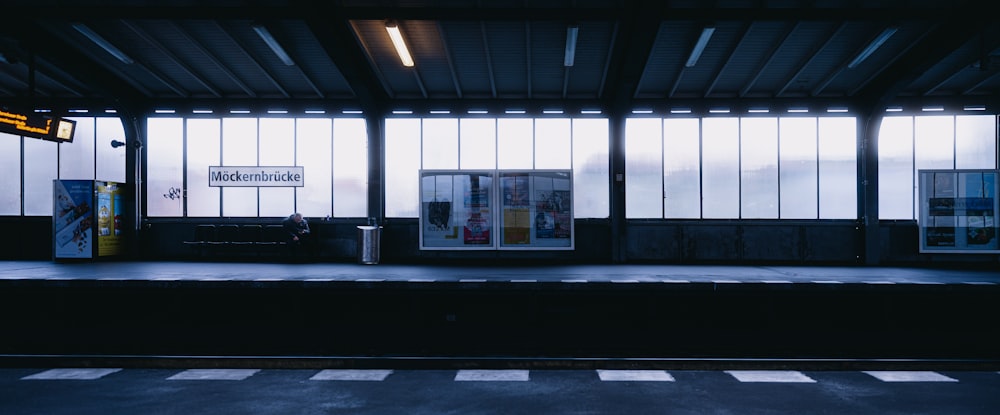 a train station with a train on the tracks