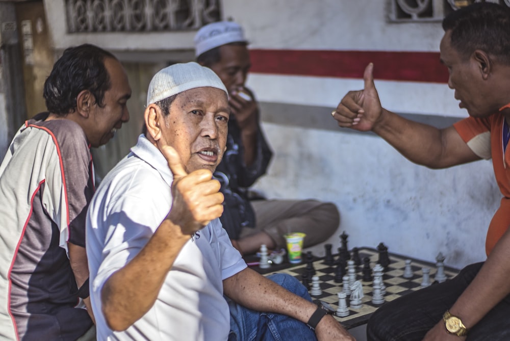 a group of men playing a game of chess