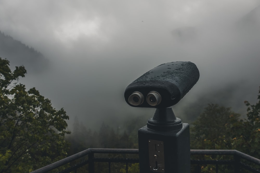 a telescope on top of a metal pole