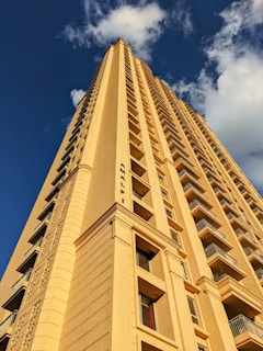 a tall building with a sky background
