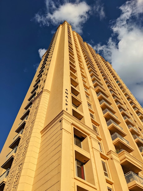 a tall building with a sky background