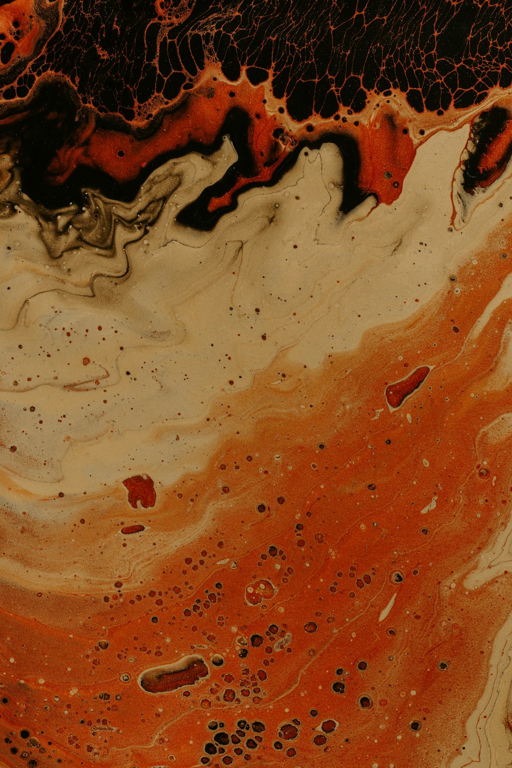 a close up of an orange and black substance