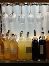 a row of wine glasses sitting on top of a counter