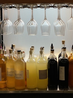 a row of wine glasses sitting on top of a counter