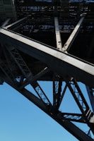 Steel girders and structural components arranged neatly, ready for flyover bridge construction.