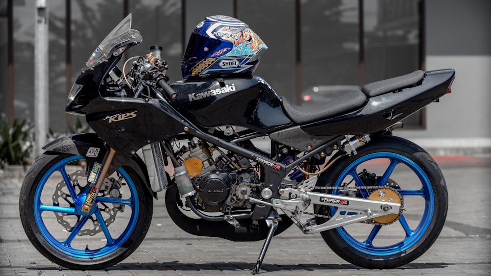 a black and blue motorcycle parked on a street