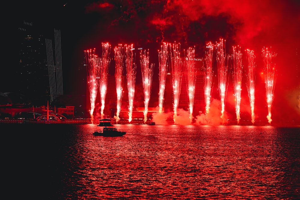 a large fireworks display over a body of water