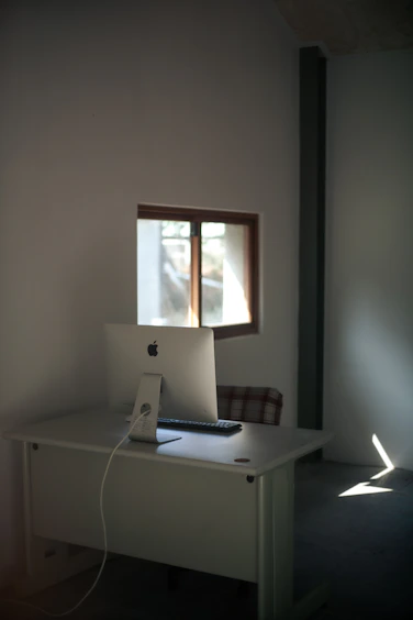 High-resolution photo showcasing a sleek, minimalist workspace with natural light.
