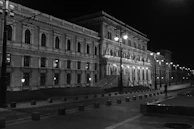 Historic architecture of Bucharest's Old Town illuminated at dusk.
