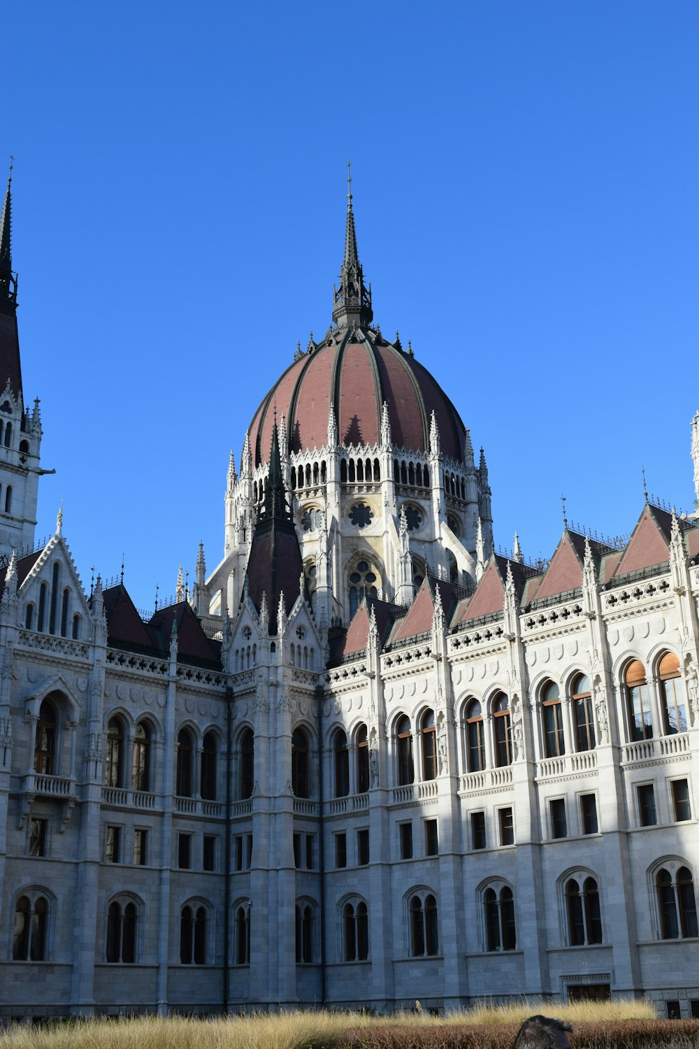 a large white building with a clock tower