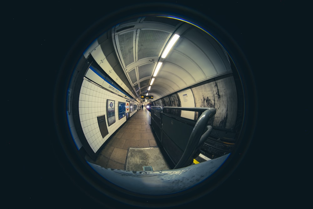 a view of a subway tunnel through a fish eye lens