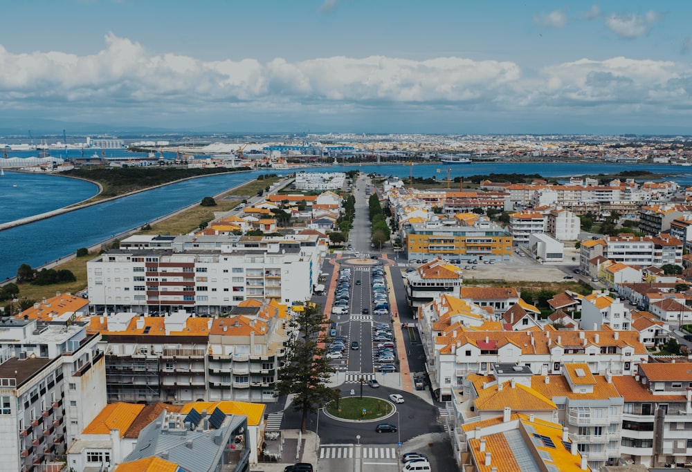 an aerial view of a city with orange roofs