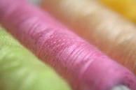An overhead shot of colorful threads and spools creating a textured palette.