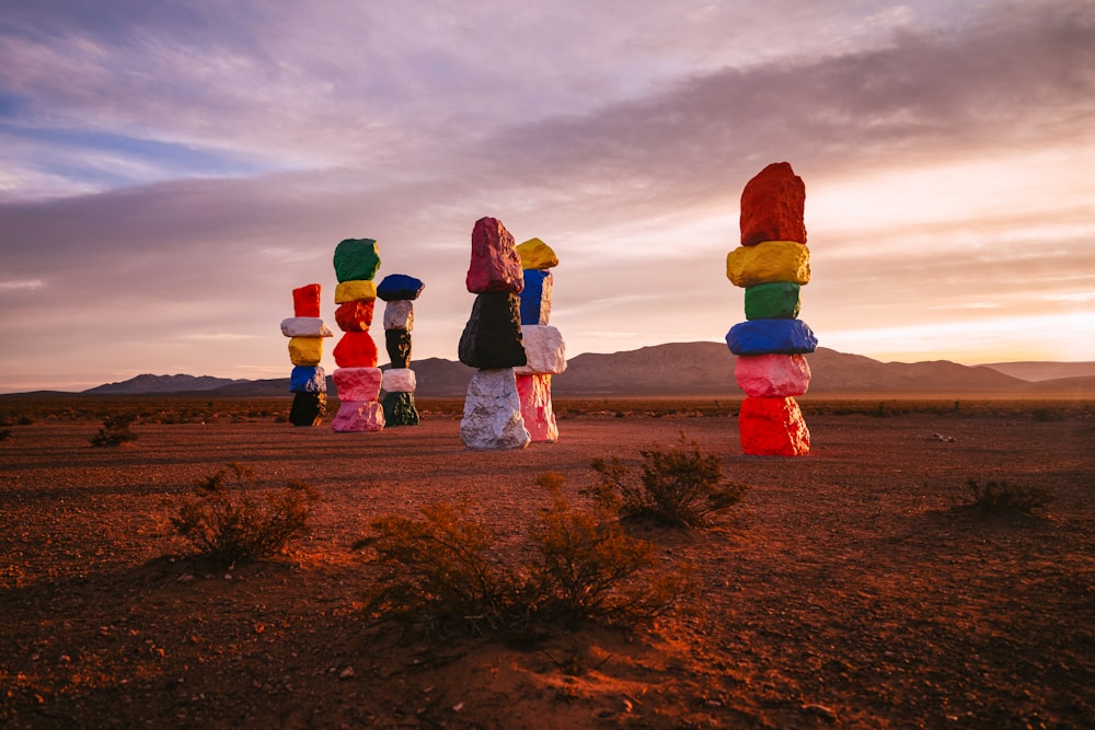 a group of sculptures in the middle of a desert